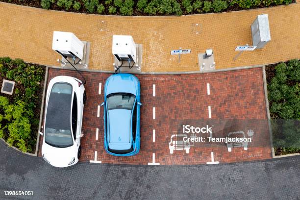 Aerial View Directly Above Electric Car Being Charged Stock Photo - Download Image Now