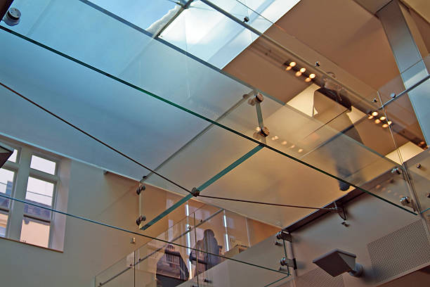 istock Glass business bridge running overhead in modern office 139865517