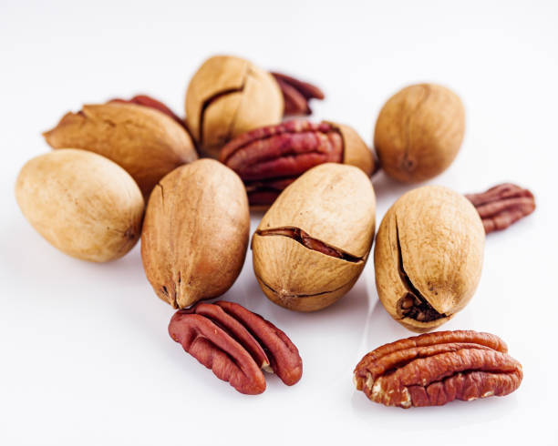 istock delicious fresh pecans on a white acrylic background 1398655375