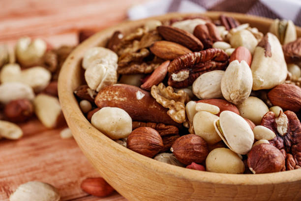 istock set of different nuts on a white acrylic background 1398655564