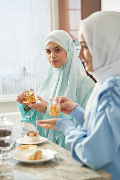 istock Calm Muslim women drinking tea at home 1398659104