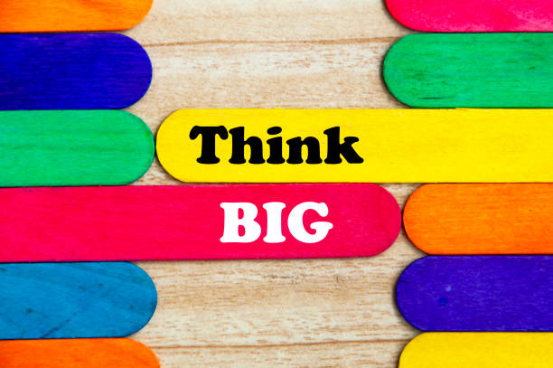 istock Think big text on colorful wooden stick - business concept 1398659365
