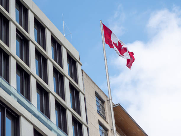 istock Canada flag on the building. Flag of Canada. 1398659579