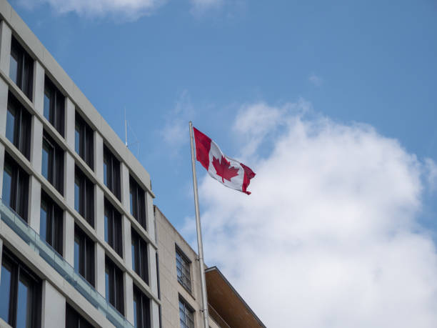 istock Canada flag on the building. Flag of Canada. 1398659588