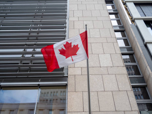 istock Canada flag on the building. Flag of Canada. 1398659594