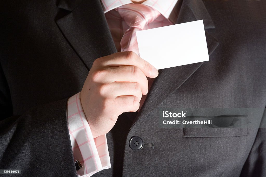 Empresario sosteniendo una tarjeta - Foto de stock de Adulto libre de derechos