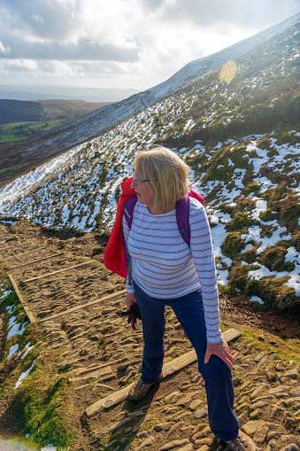 Mature Woman Hiking in Mountains Alone.