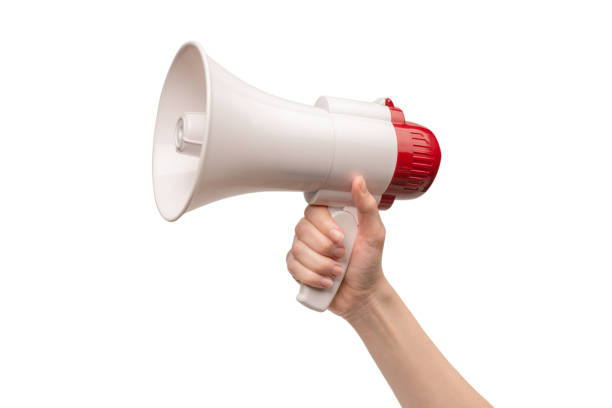 istock Megaphone in woman hands on a white background. 1398661068