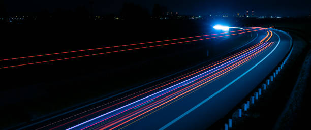 istock lights of cars with night. long exposure 1398664113