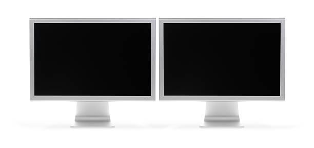 Two white LCD, extra hi-red, monitors that are turned off stock photo