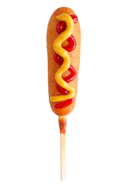 perro de maíz con ketchup y mostaza aislado sobre blanco - corn dog fotografías e imágenes de stock