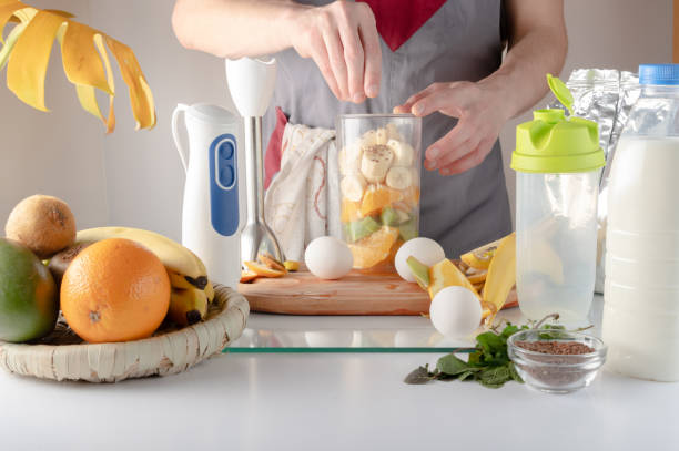 istock Adding ingredients to a cocktail. Add flax seeds to a smoothie. Adding ingredients to a shaker. 1398668307