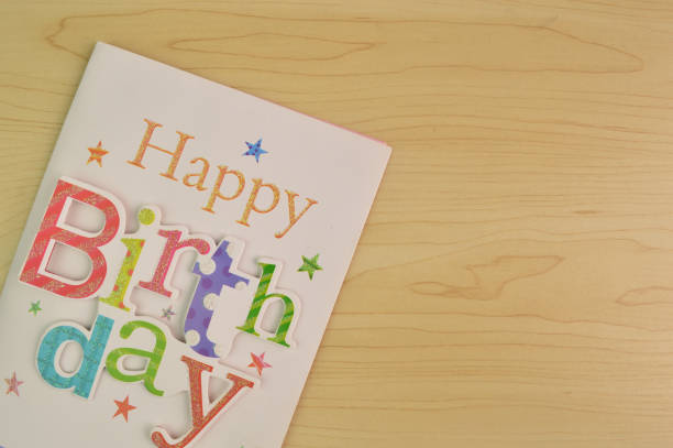 Happy birthday card with colorful decorations on the table