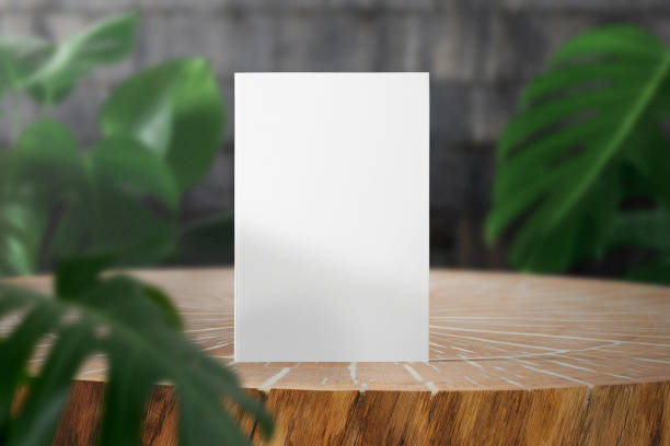 istock Clean minimal book 4x6 mockup on timber with leaves 1398673008