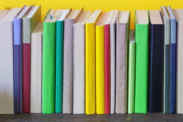 istock Different colorful books on bookshelf. Copy space 1398675154