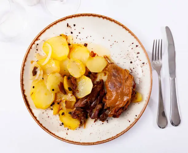 Photo of Portion of duck confit on table