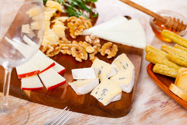 istock Various types of cheese on wooden board 1398681111
