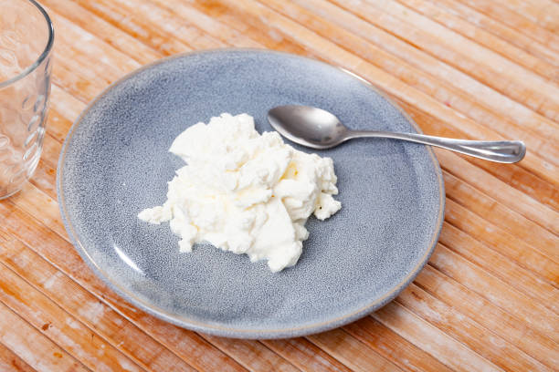 istock Fresh cottage cheese on plate 1398681389