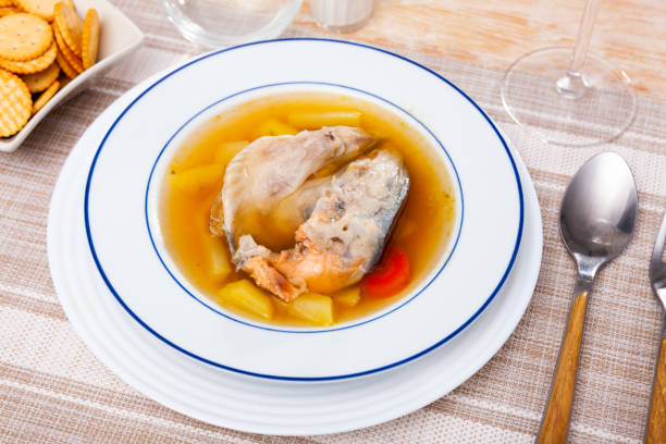 istock Fish broth with salmon head and vegetables served with salty crackers 1398681901