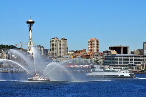 A fire boat demonstrating its capability during Seattle' s Fleet Week celebration.