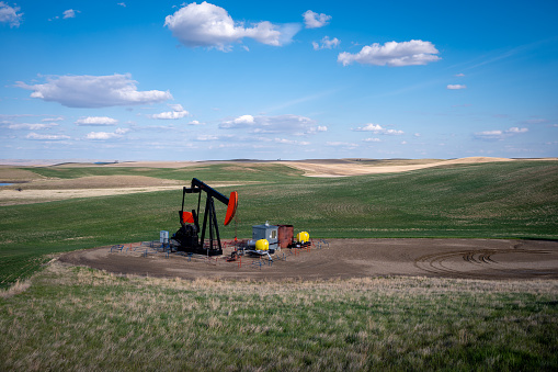Pumpjacks working in the oil fields of Alberta on a spring day.