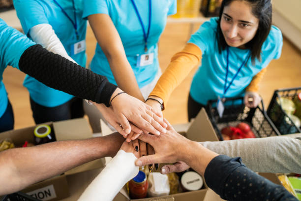 istock Elevated view of a circle of stacked hands 1398682573