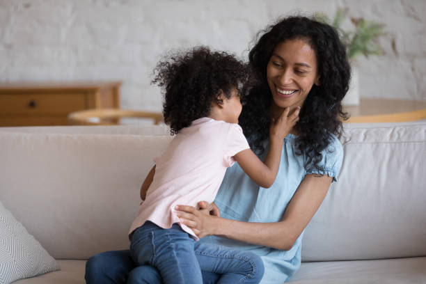 istock Active preschool African kid tickling happy cheerful mom 1398683712