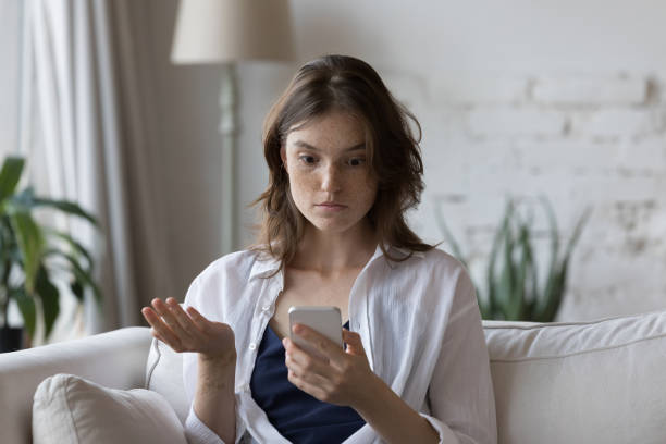 istock Shocked cellphone user girl staring at screen, looking at smartphone 1398683753
