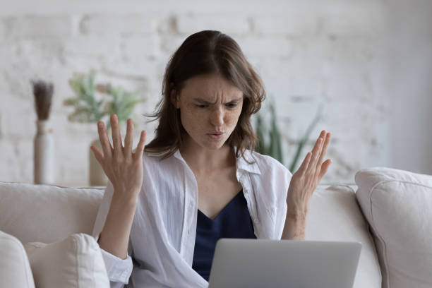 istock Frustrated angry laptop user woman annoyed with software problem 1398683781