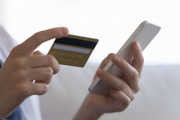 istock Female credit card user entering credit card data 1398683809