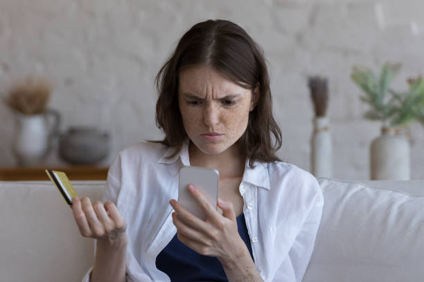 istock Puzzled confused shopper girl facing problems with online payments 1398683810