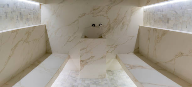 istock Classic turkish hammam. White turkish bath with marble surfaces. Marble oriental bathroom. Steam bath interior. 1398684310
