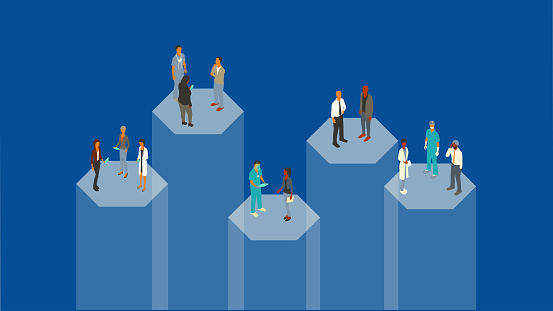 13 doctors and healthcare workers stand on 5 hexagonal pillars or silos that appear to be transparent and made of glass. Vector illustration presented in isometric view on a dark blue background, using a 16 x 9 ratio.