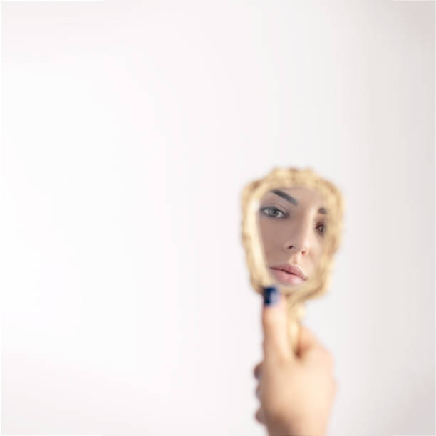 istock Part of woman face reflecting in mirror 1398686489