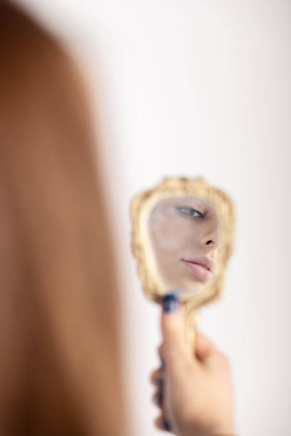 istock Part of woman face reflecting in mirror 1398686493