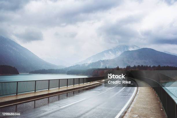 Road Over The Sylvenstein Reservoir And Isar In Bavaria On A Rainy Day Stock Photo - Download Image Now