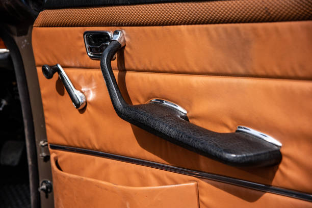 istock Classic, vintage car interior handle, orange leather 1398687285