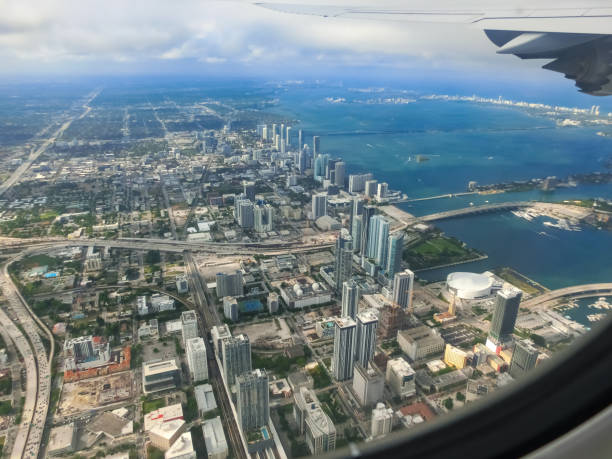 istock Miami from airplane porthole at day with blue sky 1398687438