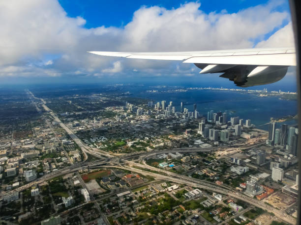 istock Miami from airplane porthole at day with blue sky 1398687439