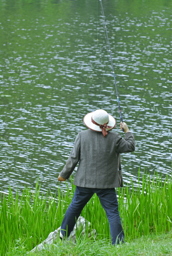 A young angler out fishing on a river for striped bass in the spring. Part of a short series.