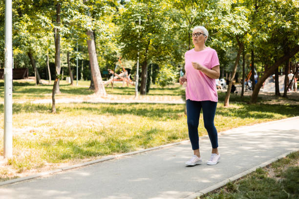 istock Senior woman jogging 1398687592