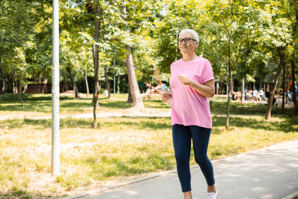 istock Active senior female jogging outdoors 1398687620