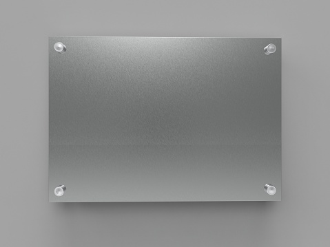 A4 faceted polished aluminum nameplate plate. Plate on spacer metal holders. Board for branding. Metallic advertising signboard on gray background. Size 297 x 210 mm. 3D illustration