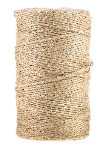 Brown thread twisted into a spool isolated on white background. Natural rope, hemp cord.