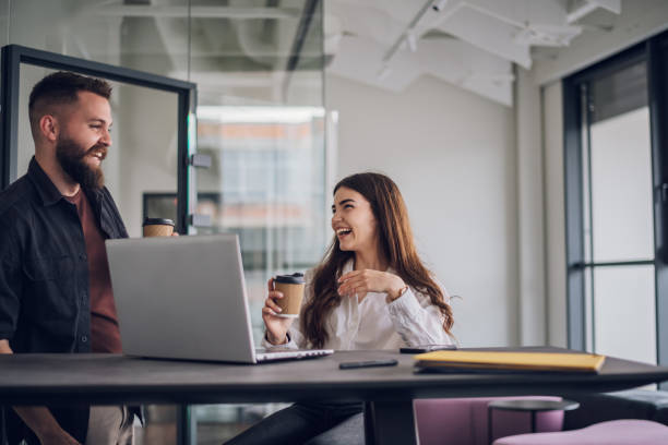 istock Two business colleagues having a meeting in the open space office 1398692516