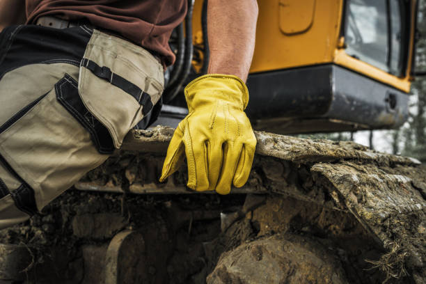 istock Bulldozer Operator Resting on a Caterpillar Track 1398694450