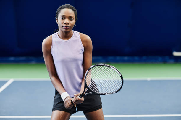 istock Woman Tennis Player Holding Racket 1398694981