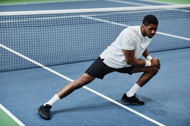 istock Sportsman Stretching at Practice 1398694996
