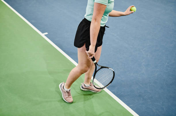 istock Young Woman Playing Tennis Minimal 1398695005