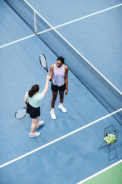 istock Girls at Tennis Practice Top View 1398695012
